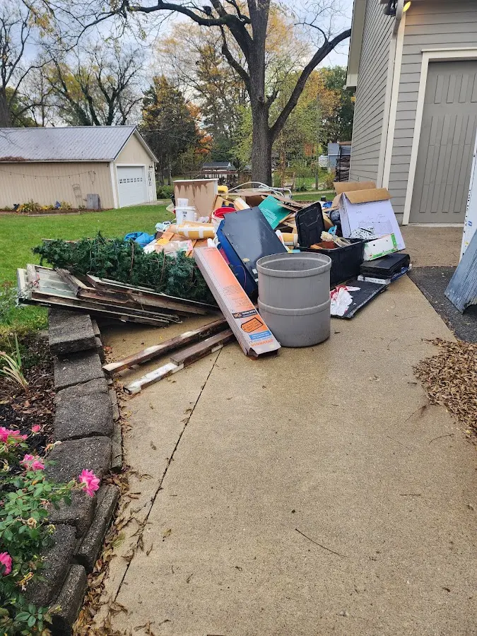 Dumpster being loaded with debris for 3 Yard Dumpster Rental in New Canaan